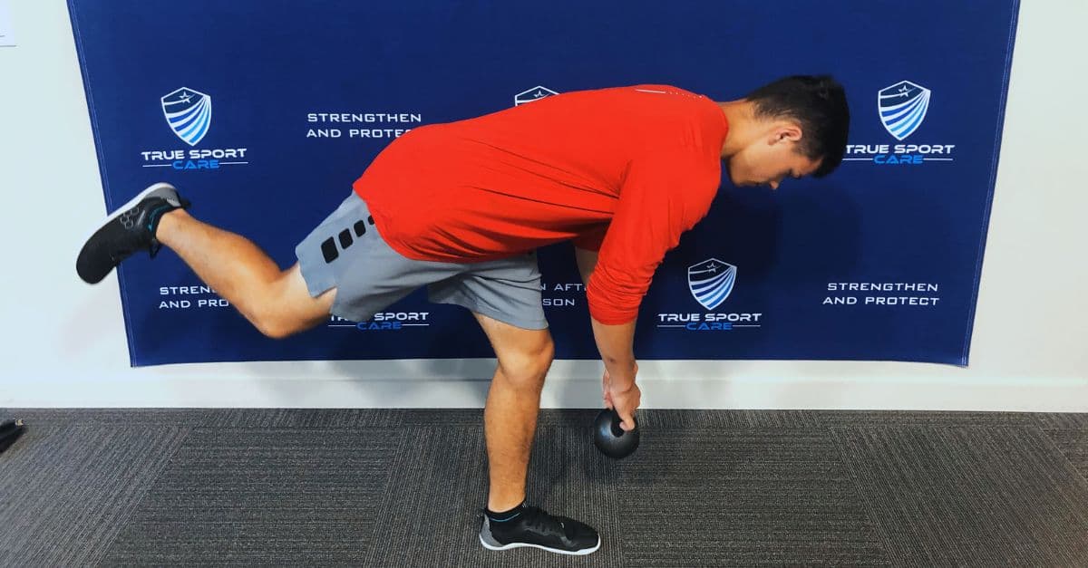 Young athlete performing corrective exercises during off-season training