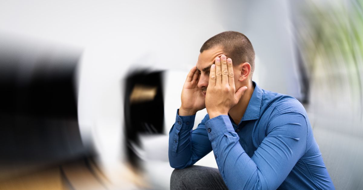 Young man experiencing vertigo