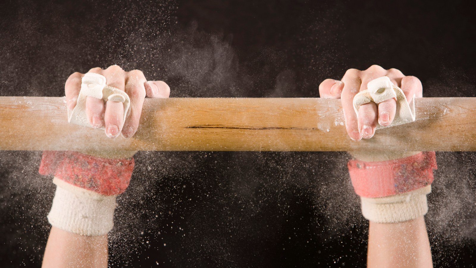 gymnastics Gymnast's hands holding on to the bar