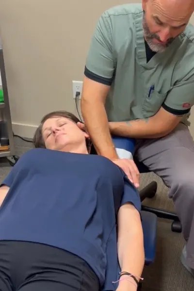 hauppauge-conditions1 Dr Marc Taczanowski performing neck adjustment on a patient